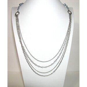 Silver Multi-Layered Chain Necklace With Blue Bead Accents & Circular Detailing